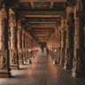 Ramanathaswamy Temple long corridor with ornate stone pillars stretching into the distance in Rameshwaram